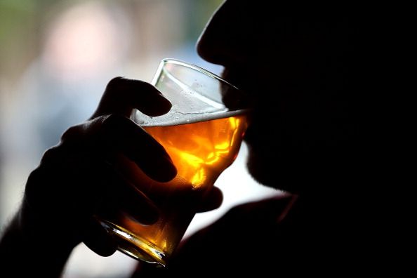 A man drinking beer.