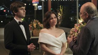 Freddie Highmore and Paige Spara dressed for a wedding in The Good Doctor