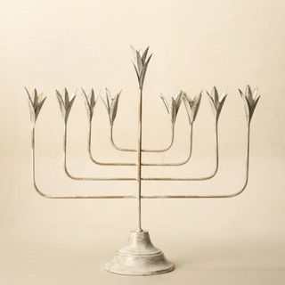 White Leaf Menorah against a cream background.