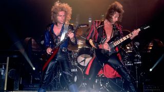 K.K. Downing (left) and Glenn Tipton perform live onstage with Judas Priest on June 11, 1984 in Chicago