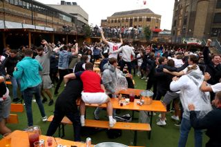 England fans celebrate at a beer garden in London