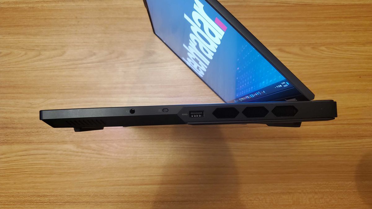 side view of black gaming laptop with rgb lit keyboard