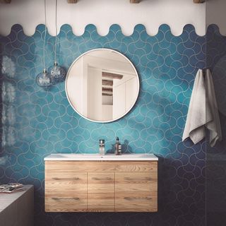 bathroom with blue tiles wall and mirror with towel