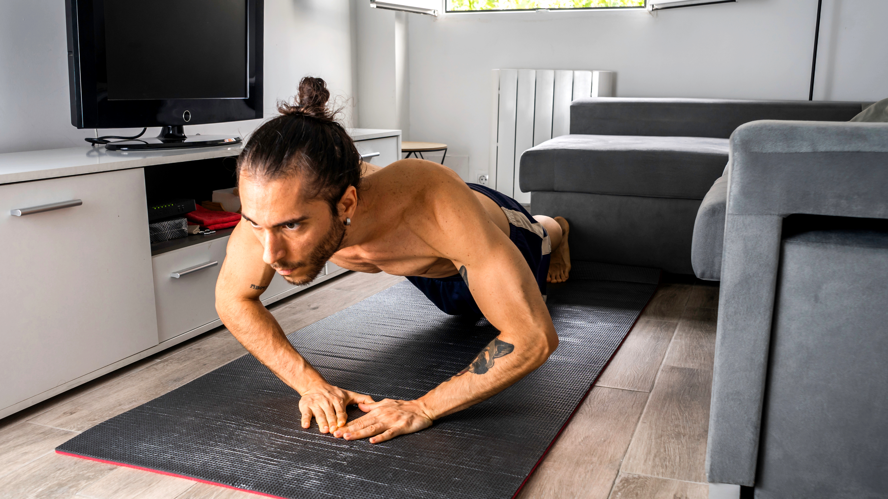a man doing a diamond push up