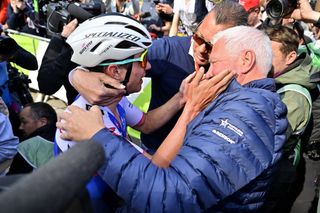 Remco Evenepoel celebrates winning Liege-Bastogne-Liege with Patrick Lefevere