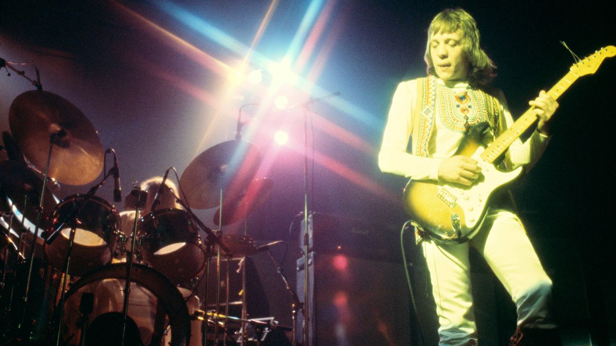 Robin Trower performing on stage in 1975