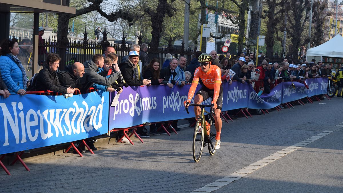 Greg Van Avermaet rides to the startline in Antwerp in his gold accented Giant helmet