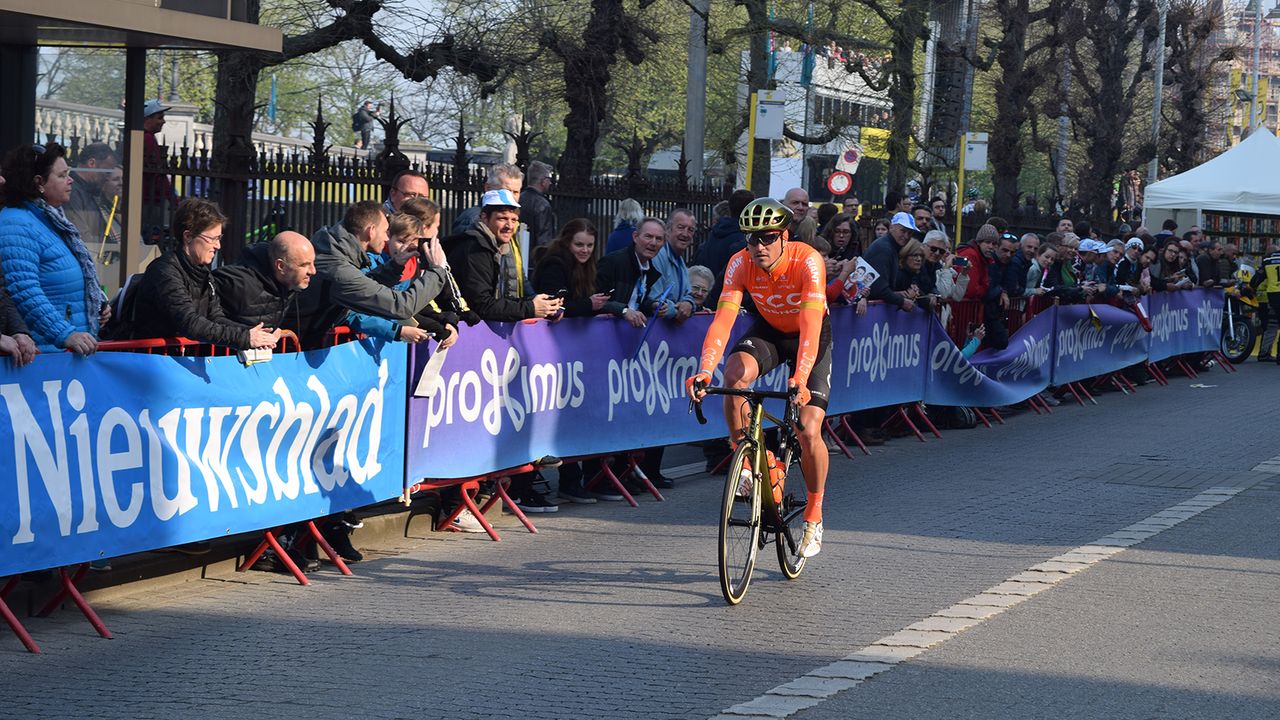 Greg Van Avermaet rides to the startline in Antwerp in his gold accented Giant helmet