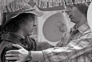 Owsley Stanley (left) talking with Grateful Dead bassist Phil Lesh in 1975