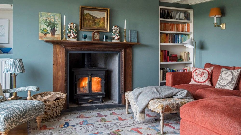 living room harbour blue wall wooden floor cautch and table