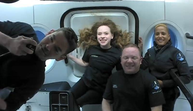  The four private astronauts of SpaceX&#039;s Inspiration4 mission smile in space in this still image from Sept. 16, 2021. From left they are: Jared Isaacman, commander; Hayley Arceneaux, medical officer; Chris Sembroski, mission specialist; Sian Proctor, pilot.