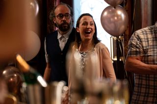 Reiss Colwell and Sonia Fowler looking happy in the Queen Vic surrounded by engagement decorations