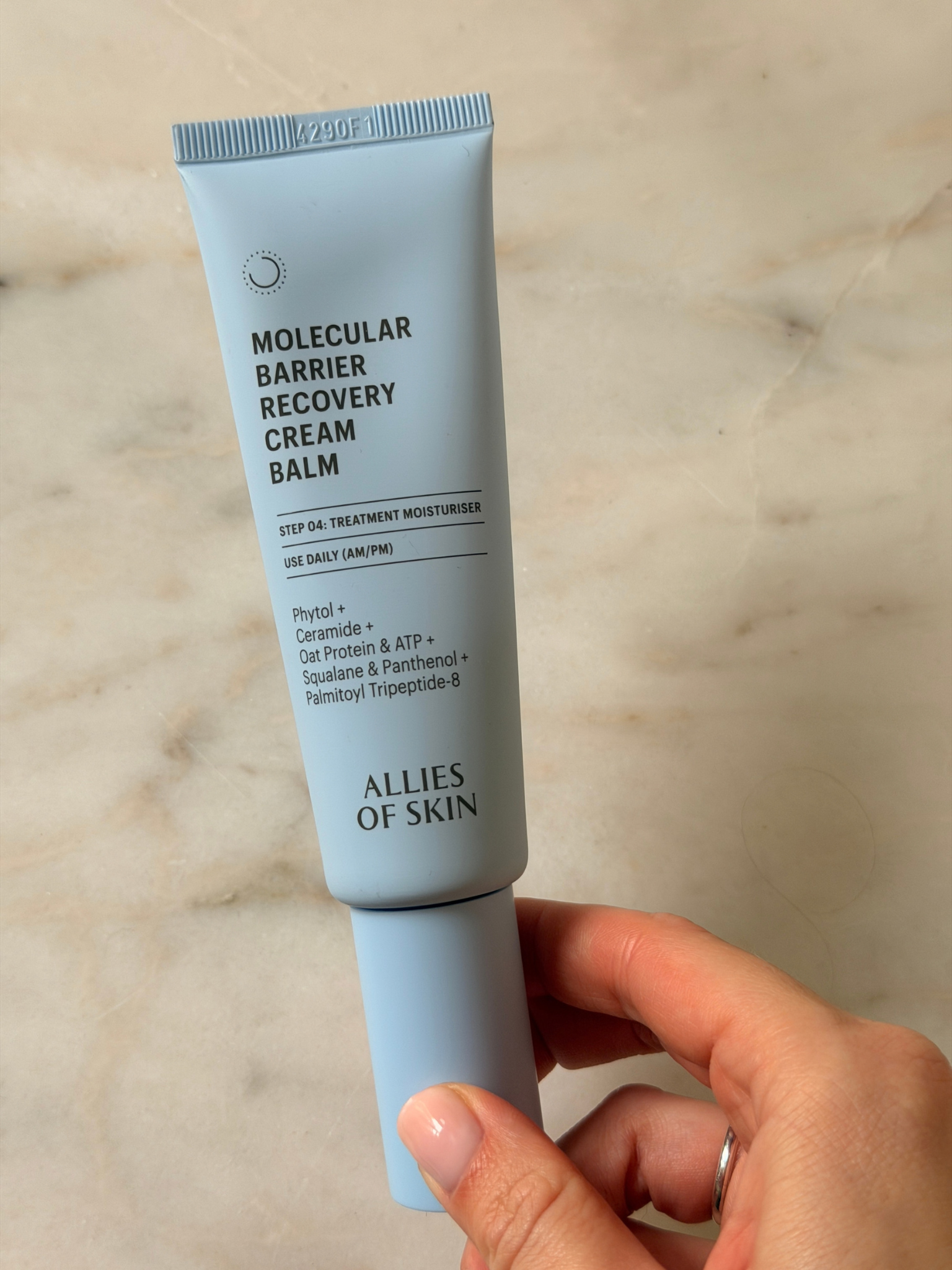 Freelance beauty editor Grace Day holding the Allies of Skin moisturiser