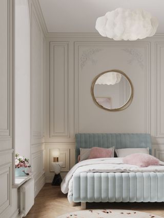 A bedroom largely white with a blue bed