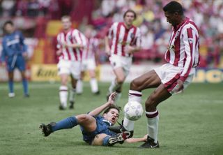 Sheffield United's Brian Deane competes for the ball with Manchester United's Darren Ferguson on the opening day of the inaugural Premier League season in August 1992.