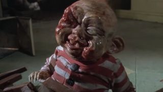 Screenshot of bloody Baby Selwyn in Dead Alive