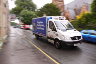 Tesco online home delivery shopping van driving to deliver food