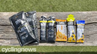 A bunch of SIS Energy products on a wooden bench