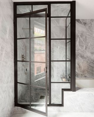 Tiny bathroom with steel-framed shower enclosure