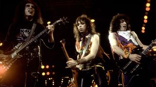 From left, American rock musicians Gene Simmons, Vinnie Vincent, and Paul Stanley, all of the group Kiss, perform onstage at the UIC Pavillion, Chicago, Illinois, February 15, 1984.