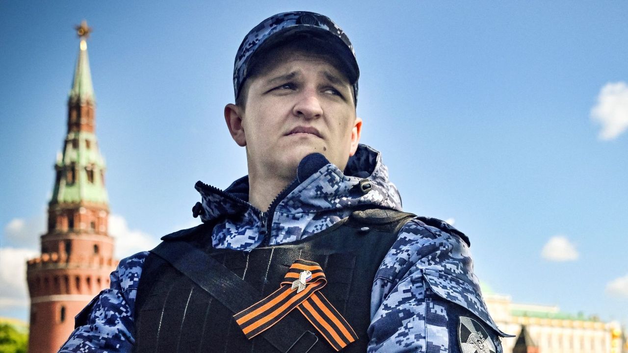 A Russian National guard serviceman stands guard outside the Kremlin