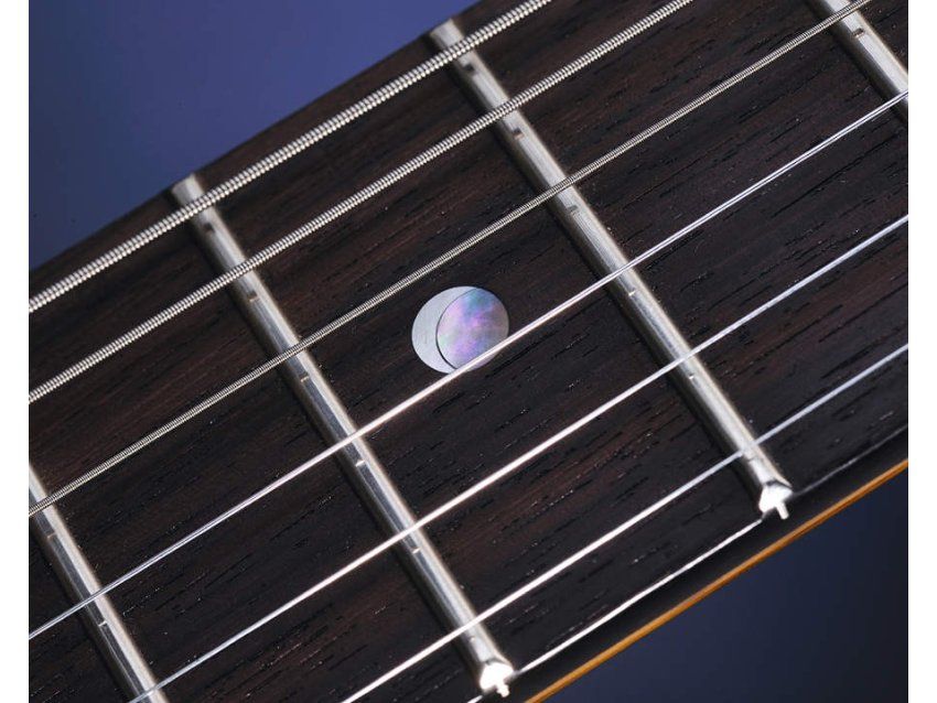 The rosewood neck is Indian rather than the rare and expensive Brazillian