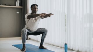 Man performing squat exercise