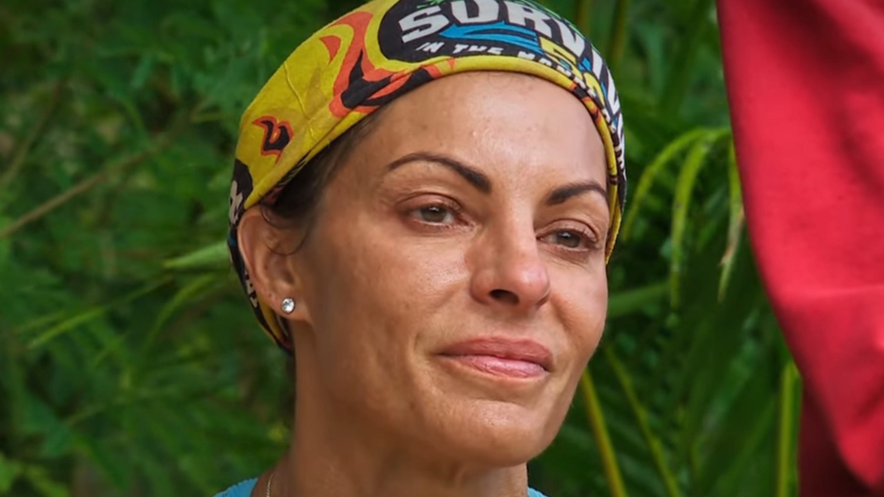 Stephenie looks at the letters from home during the Survivor 50 auction. 
