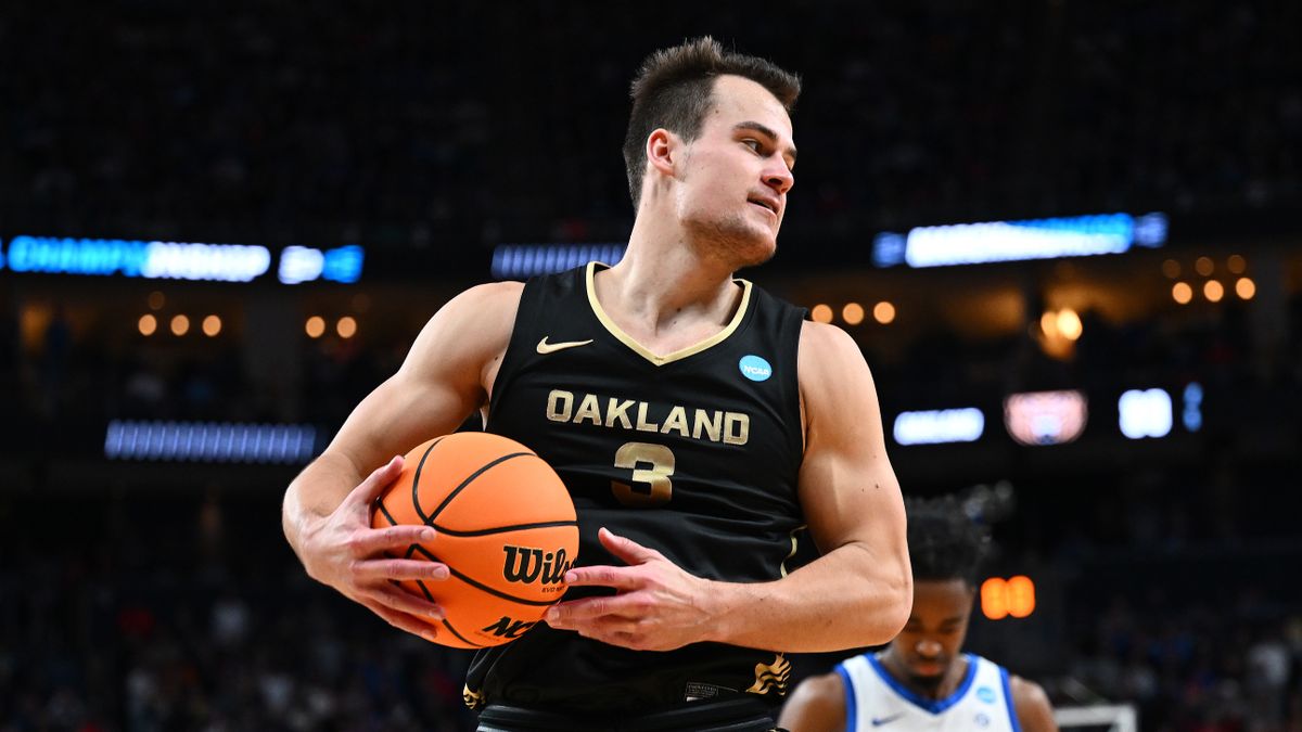 Jack Gohlke #3 of the Oakland Golden Grizzlies controls the ball ahead of the NC State vs Oakland March Madness 2024 game.