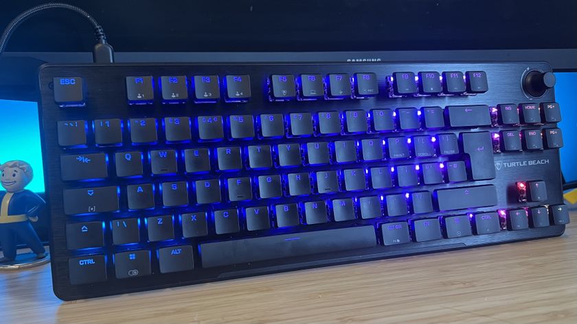 Turtle Beach Vulcan II TKL gaming keyboard on a wooden desk