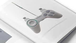 A photo shows a page in the upcoming photography book PlayStation: The First 30 Years that shows a green and grey controller
