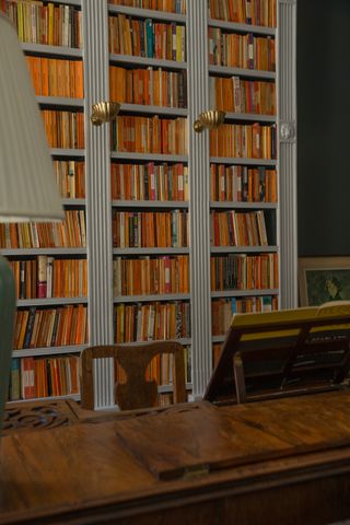 Bookshelves in library in period home