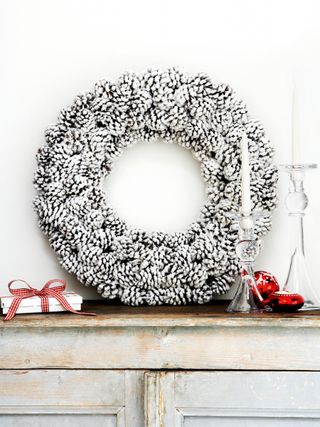 wreath made from white painted pine cones