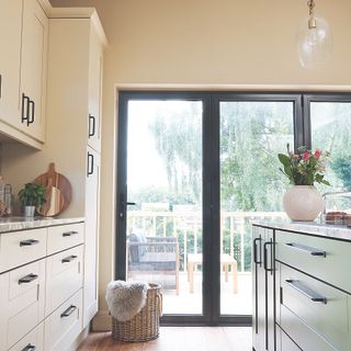 Cream kitchen with black french doors