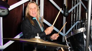 Nicko McBrain behind a drum kit