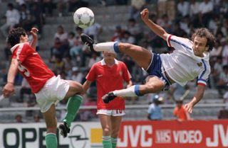 France's Michel Platini attempts an acrobatic volley against Hungary at the 1986 World Cup in Mexico.