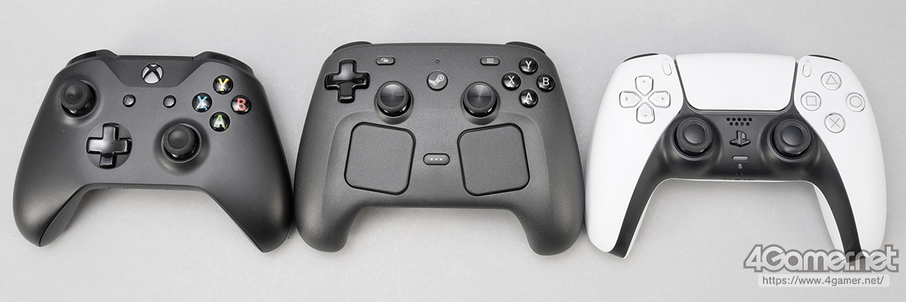 Three gaming controllers: a black Xbox controller, a black third-party controller, and a white PlayStation controller, displayed side by side on a gray background.