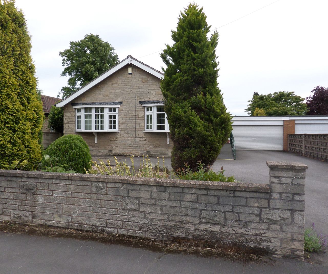 front view of an old bungalow before a renovation