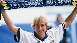 German footballer Jürgen Klinsmann holds up a Tottenham Hotspur scarf after signing with the club, 4th August 1994. (Photo by Gary M. Prior/Getty Images)