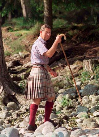 King Charles on a hike in a kilt