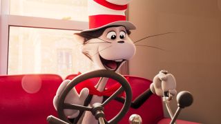 The Cat in the Hat sits happily at the couch's drivers seat.