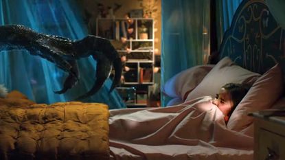 A raptor goes bump in the night in Jurassic World: Fallen Kingdom.