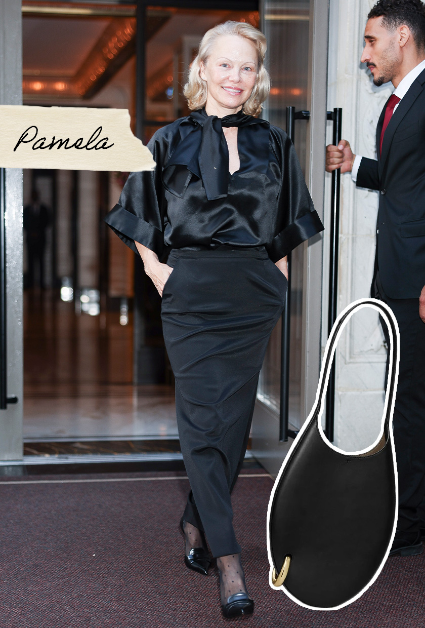 Pamela Anderson wearing a silk blouse and a maxi skirt.