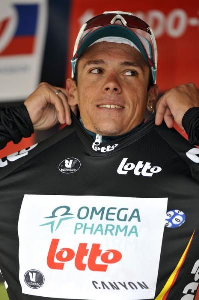 Philippe Gilbert (Omega Pharma-Lotto) pulls on the black jersey after winning stage 1.