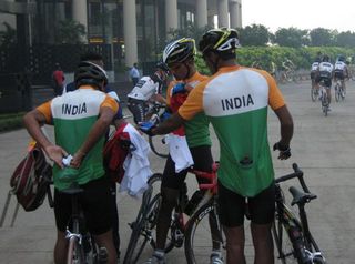 The India national team getting ready to leave from the Trident Bandra Kurla Hotel to the race course of the Mumbai Cyclothon, Saxo Bank riders leaving in the background.