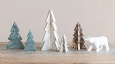 Marble Christmas trees pictured atop of a wooden tabletop