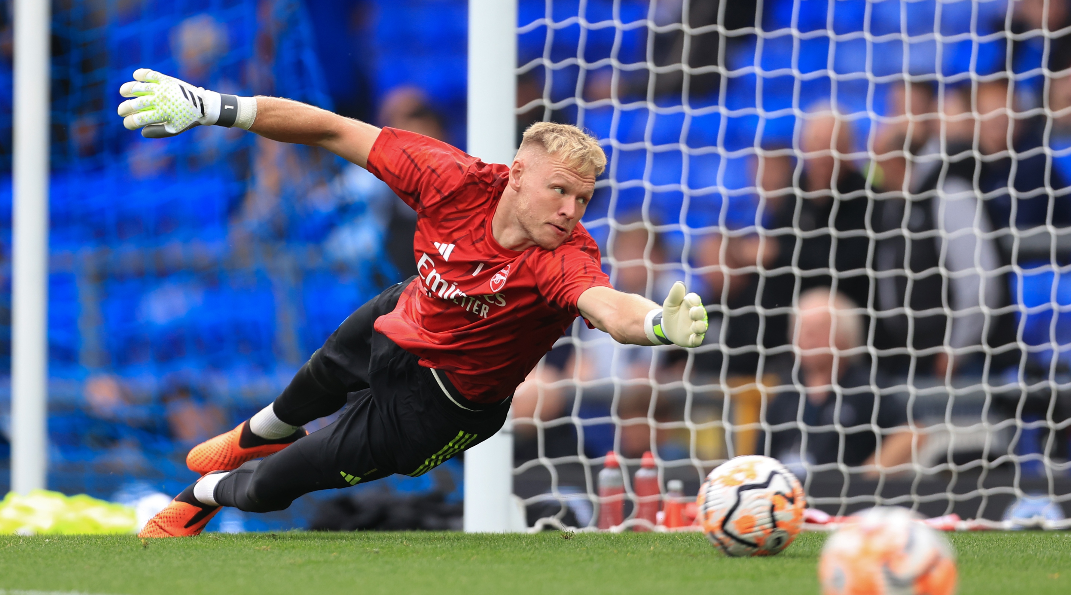 Arsenal goalkeeper Aaron Ramsdale appears to be kicked by