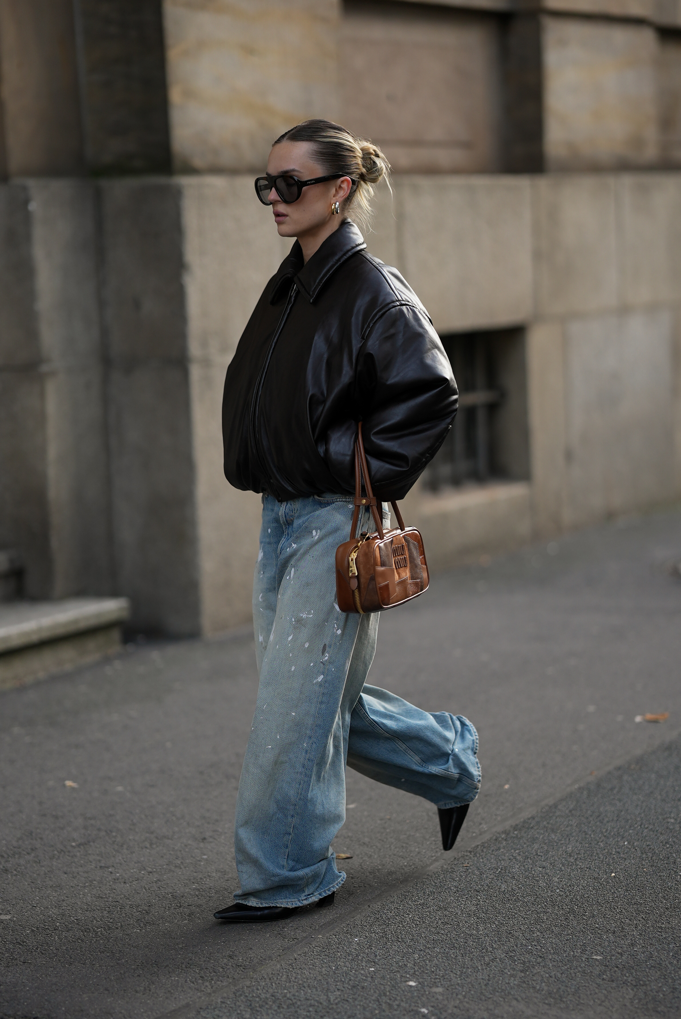 Woman wearing a light wash jeans outfit.