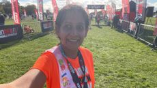 Minreet Kaur standing at the start line of a running race 