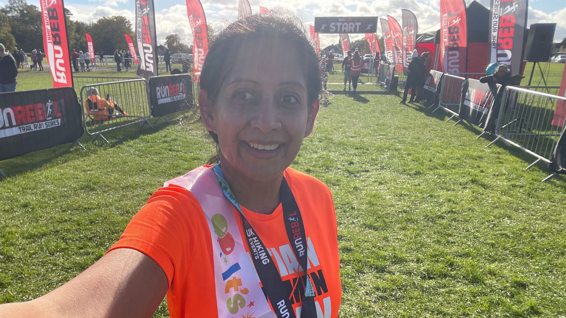 Minreet Kaur standing at the start line of a running race